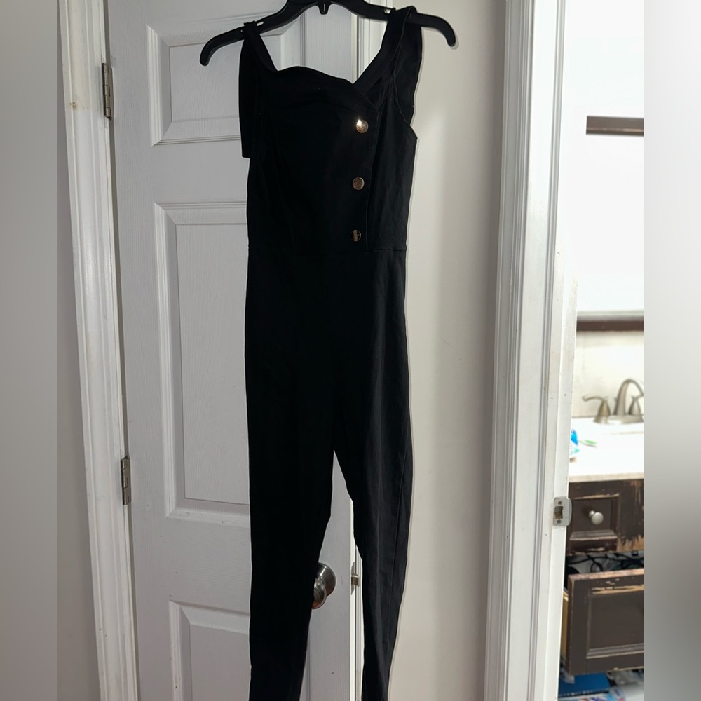 -One piece over all with gold buttons on the top